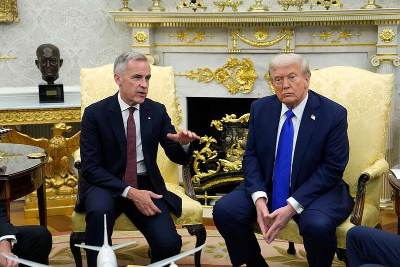 FILE - Canada Prime Minister Mark Carney and President Donald Trump hold a press conference at the White House in Washington, D.C., Oct. 7, 2025. (Adrian Wyld/The Canadian Press via AP, File)