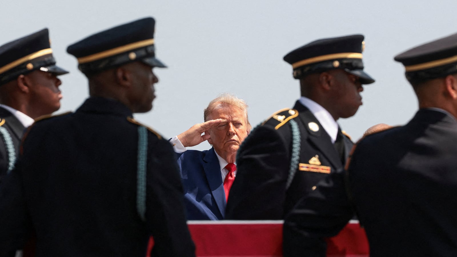 U.S. President Donald Trump salutes as members of the military carry the transfer case of U.S. Army Pvt. Isabella Gonzales of the 1st Battalion, 57th Air Defense Artillery Regiment, 52nd Air Defense Artillery Brigade, 10th Army Air Missile Defense Command, who was killed during an attack at Muwaffaq Salti Air Base in Jordan, during a dignified transfer of her remains at Dover Air Force Base in Dover, Delaware, U.S., July 22, 2026. REUTERS/Evelyn Hockstein TPX IMAGES OF THE DAY
